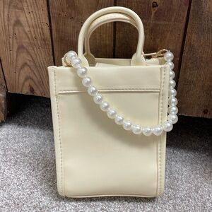 Target butter yellow mini bag with pearl details